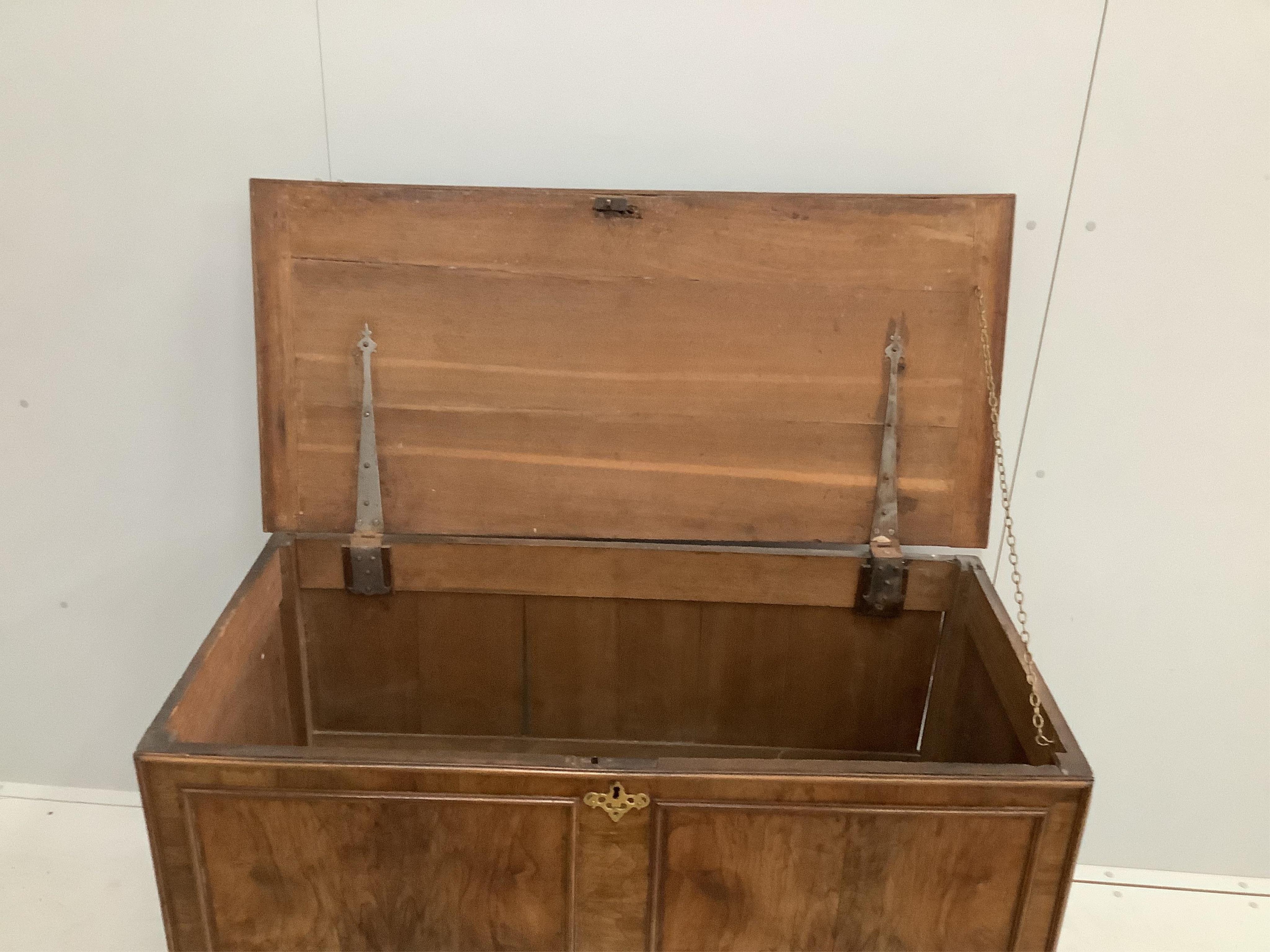 A George I / II feather-banded walnut and oak mule chest, width 120cm, depth 57cm, height 84cm. Condition - fair